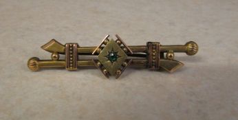 9ct gold brooch with central emerald sto