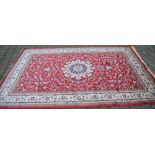 Red ground Kashmir carpet with a Shahbaz