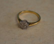 18ct gold daisy ring with 0.5ct of diamo