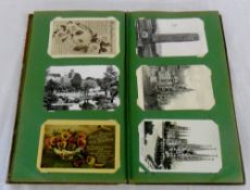 Postcard album containing miscellaneous