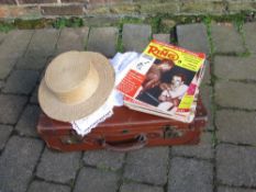 Vintage suitcase with straw boater, doil