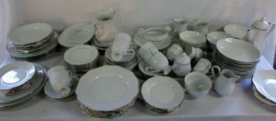 Large quantity of white with silver trim