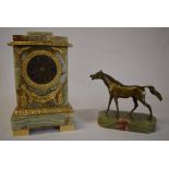 An onyx cased mantle clock and a bronze