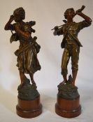 A pair of spelter figures raised on circ