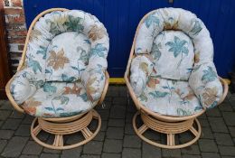 Pair of cane swivel conservatory chairs