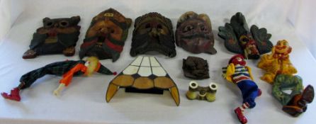 Various carved masks, ceramic clowns, op