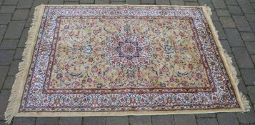 Gold ground Kashmir rug with a Shahbaz d