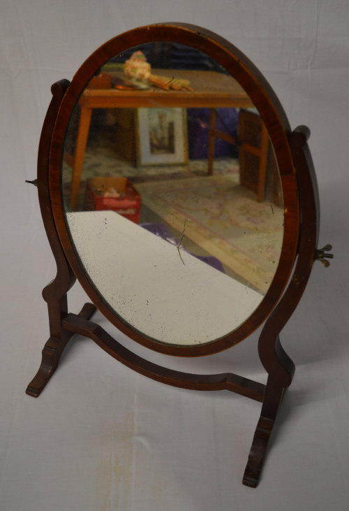 An Edwardian oval toilet mirror