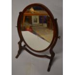 An Edwardian oval toilet mirror