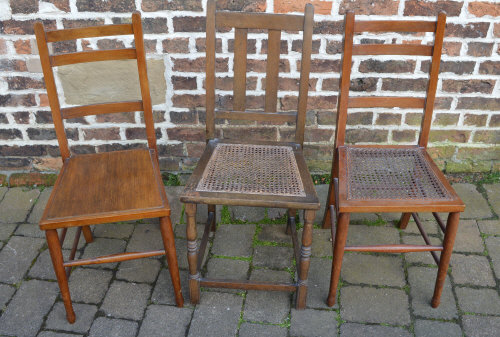 2 cane seated chairs and one other chair