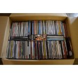 Box of various music CDs