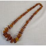 String of irregular amber beads length a