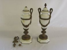 Pair of ornate lidded classical vases (a