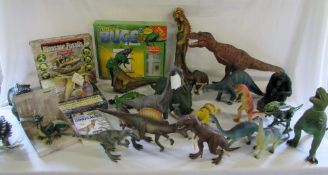 Quantity of toy dinosaurs, bug kit, book