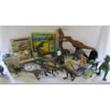 Quantity of toy dinosaurs, bug kit, book