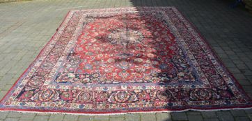 Red ground Persian Mashhad carpet (full