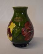 Moorcroft vase with small chip to the bo