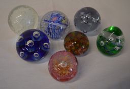 7 various glass paperweights