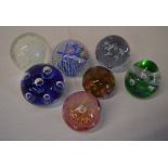 7 various glass paperweights