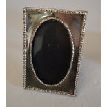 Silver picture frame with beaded decorat