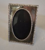 Silver picture frame with beaded decorat