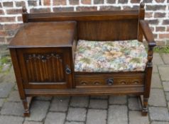 Oak telephone table with linen fold pane
