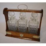 Late Victorian Tantalus with 3 decanters