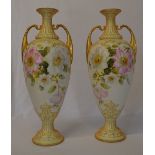 A pair of hand painted vases in the Roya