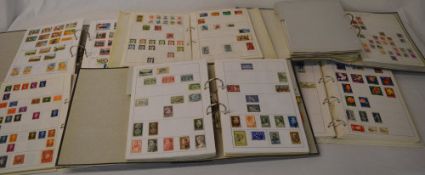 7 stamp albums covering most countries,