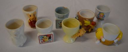 Various collectable egg cups including M