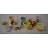 Various collectable egg cups including M