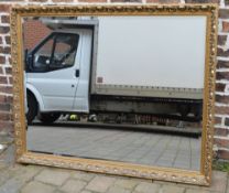 Large ornate gilt framed wall mirror wit