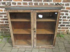 Glass fronted wall cabinet