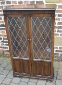 Dark wood display cabinet with leaded gl