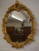 Ornate gilt framed wall mirror