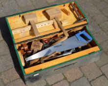 Wooden toolbox with various hand tools