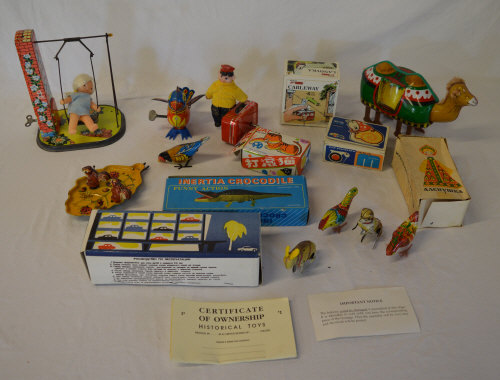 Various wind up toys including a crocodi