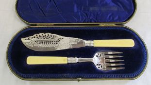 Cased set of ornate silver fish servers