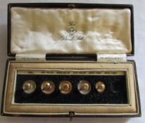 The O.P stud set containing 9ct gold stu