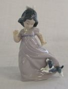 Nao figure of a young girl with a puppy