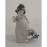 Nao figure of a young girl with a puppy