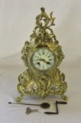 French brass mantle clock in the rococo