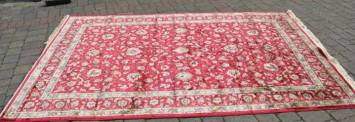 Red ground Kashmir carpet with a unique