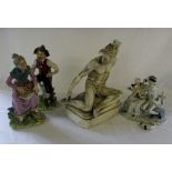 Pair of figurines, soldier figure signed