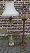Plant stand and an ornate standard lamp
