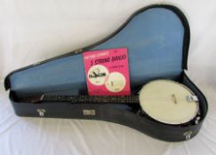 Banjo with case and book