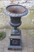 Cast iron urn on stand, height approx 10