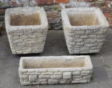 Pair of stone wall effect planters and a