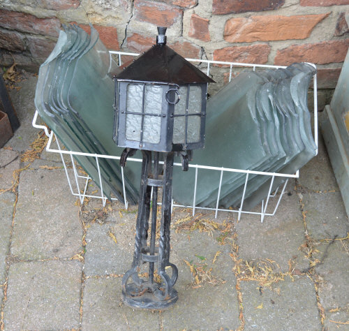 Glass pan tiles and a Newel post lamp