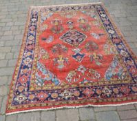 Red and blue Persian carpet 252cm x 163c